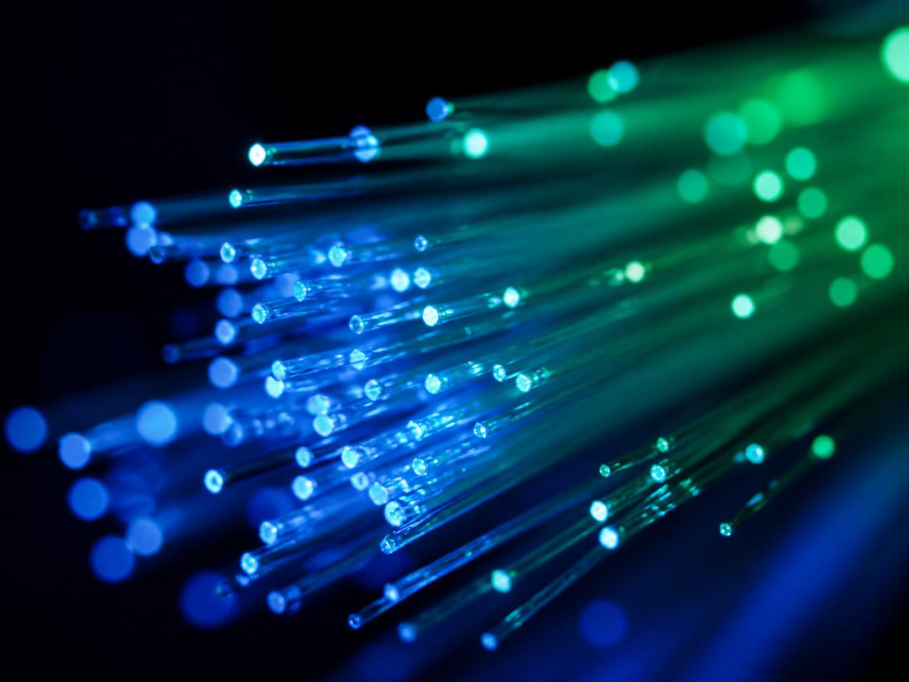 Fiber optic strands being spliced, one of the best AI-proof careers in 2026